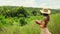 Tourist takes notes in the savannah about the life of giraffes in the wild