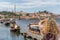 A tourist takes a photo of the famous rabelos boats in the city of Oporto. The rabelo boat is a Portuguese boat, typical of the