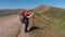 A tourist takes photographs during a hike in the Carpathians