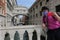 Tourist takes a selfie with the Bridge of Sighs behind him
