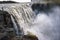 Tourist takes a selfie photograph at the Dettifoss waterfall in Iceland