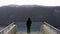 A Tourist Takes in the View from a Lookout Point in Norway