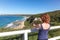 Tourist taking photo of Burwood Beach - Newcastle Australia