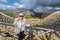 Tourist taking photo in front of greek theater of Segesta, Sicily, Italy