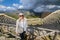 Tourist taking photo in front of greek theater of Segesta, Sicily, Italy