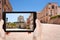 Tourist taking photo of medieval Episcopal Palace