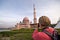 Tourist taking photo of Putra Mosque, Malaysia