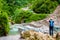 Tourist taking photos on the trek in Annapurna Conservation Area, Nepal