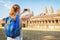 Tourist taking picture of the Angkor Wat complex, Cambodia