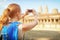 Tourist taking picture of the Angkor Wat temple in Cambodia