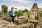 Tourist taking picture from top of Pre Rup in Angkor, Cambodia