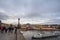 Tourist taking a selfie on Charles bridge, or Karluv Most, crowded with visitors, over the Vltava river