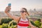 Tourist taking selfie with Florence cityscape Tuscany Italy