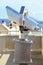 Tourist telescope look at the city of Marseille in France from a high point, close-up of metal binoculars on the background of an