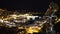 Tourist telescope, romantic night view of beautiful illuminated city at seaside