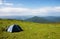 Tourist tent on an Alpine meadow