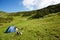 Tourist tent on an Alpine meadow