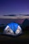 Tourist tent camping on top of mountains overlooking scenery vie
