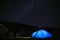 The tourist tent is illuminated by light. Starry sky. Tourism and active recreation. Overnight, camping in the Carpathian
