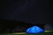 The tourist tent is illuminated by light. Starry sky. Tourism and active recreation. Overnight, camping in the Carpathian