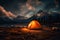 A tourist tent stands in the mountains under the night sky 2