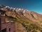 Tourist on the terrace of a building in traditional moroccan mountain village Tacheddirt