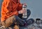 Tourist with a thermos. woman pours tea on the nature