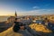 Tourist on top of a hill enjoys the view of Luderitz in Namibia at sunset