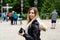 Tourist at Totem poles in Stanley Park, Vancouver, British Colum