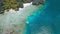 Tourist tour trip banca boats in shallow water at Shimizu Island in El Nido, Palawan, Philippines. Intact coral reef