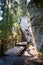 Tourist trail with wooden path walk and stairs near sandstone cliffs. river gauja in Latvia. The cliff of Sietiniezis