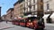 Tourist train on the main street of Bologna.