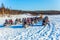 Tourist train from snowmobiles moves