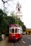 Tourist Tram in Lisbon in front of Bell Tower