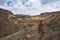 Tourist trekking on marked trail in the Golden Gate Highlands National Park, South Africa. Scenic table mountains, canyons and cli