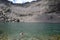 Tourist trying to swim in cold mountain lake