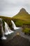 Tourist under the waterfall in Iceland, Adventure photo, edit sp