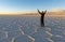 Tourist in Uyuni Salt Desert at Sunset, Bolivia