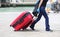 tourist in Venice with suitcases while walking