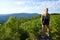 Tourist on the viewpoint under the top of Pancir mountain. National Park Sumava, Czech republic.