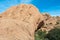 Tourist is visible on rocks above cave at Bushmans Paradise