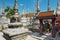 Tourist visit ancient stupas at Wat Phra Mahathat Woramahawihan temple in Nakhon Sri Thammarat, Thailand.