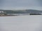 Tourist waiting on the beach for boat crossing to Saint Michael\\\'s Mount Cornwall England