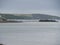 Tourist waiting on the beach for boat crossing to Saint Michael\\\'s Mount Cornwall England