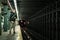 Tourist waiting the Metro under the Lights in Brooklyn, New York