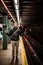 Tourist waiting the Metro under the Lights in Brooklyn, New York