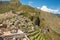 Tourist walk on Machu picchu ruins