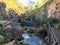 Tourist walk to natural landmark Honey Waterfalls