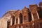 Tourist walking around beautiful Roman architecture of the Ad Deir one of the most iconic monuments in the Petra Archaeological