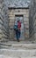 Tourist walking with backpack inside corridors of Machu Pichuu